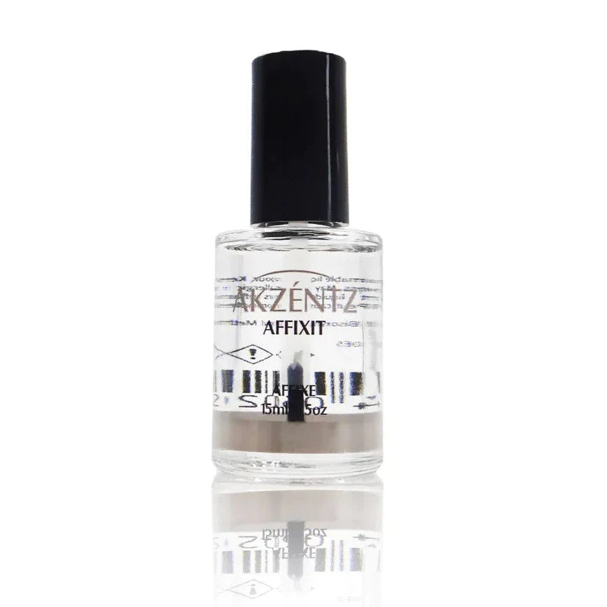 A bottle of AKZENTZ AFFIXIT, Acid -Free Bonder (Primer) with a black cap on a reflective surface.