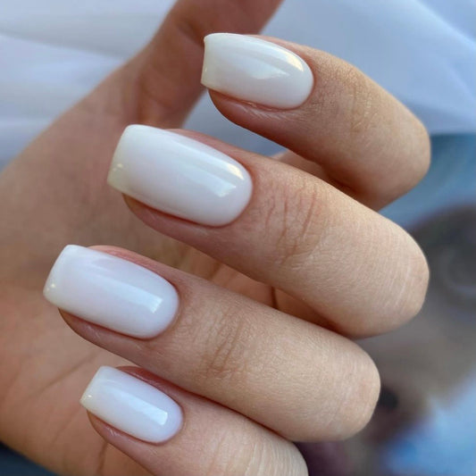 LUXIO by AKZENTZ - COY Gel Color glossy manicure close-up.