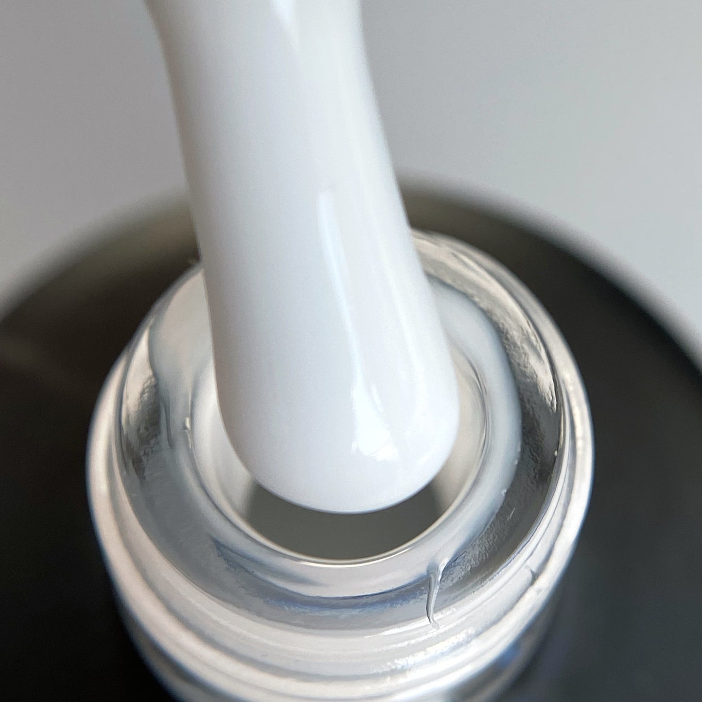 Close-up of Grani Art Base Milk label on product bottle.