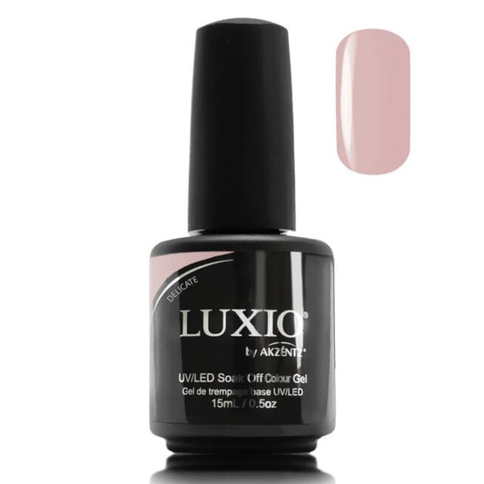 A bottle of Luxio nail gel in a nude pink color, with the brand name and product details printed on the label.