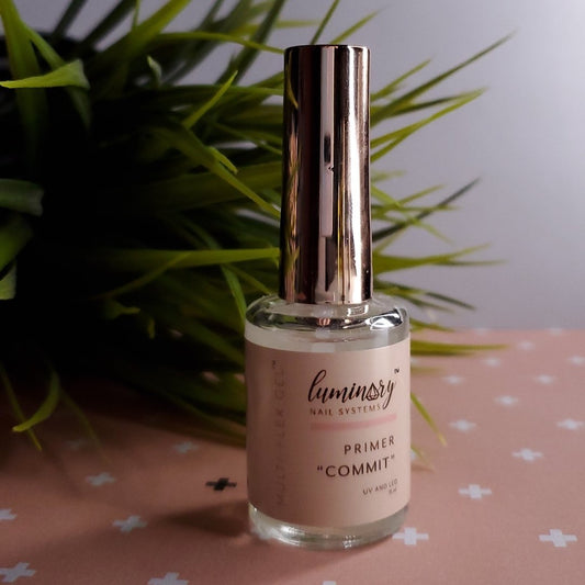Commit Primer by Luminary Nail Systems, apply to free edge and tips for stronger adhesion